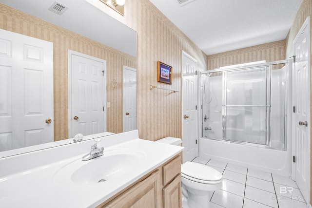 full bath featuring wallpapered walls, visible vents, enclosed tub / shower combo, tile patterned flooring, and vanity