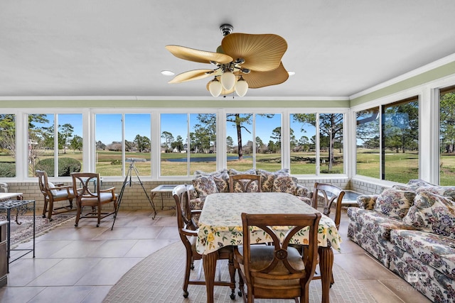 sunroom featuring a ceiling fan