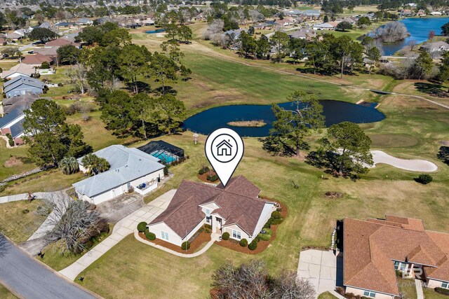 drone / aerial view with a water view, a residential view, and golf course view