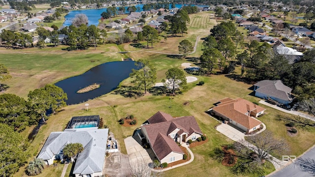 birds eye view of property featuring a water view and a residential view