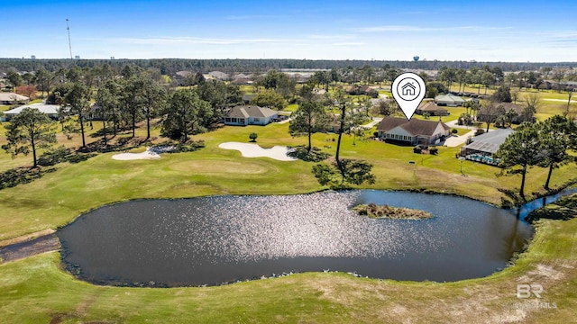 birds eye view of property featuring view of golf course and a water view