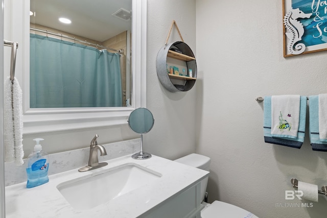 full bathroom with visible vents, toilet, a shower with shower curtain, vanity, and a textured wall