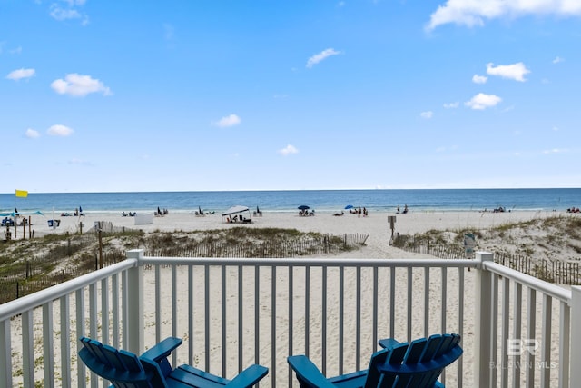 balcony with a view of the beach and a water view