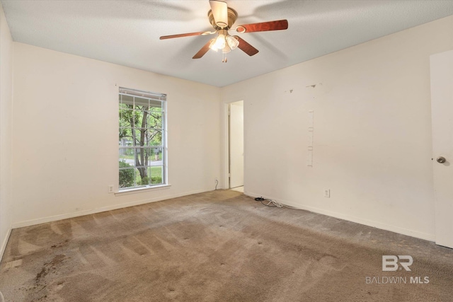 2405 Pavan Dr, Mobile, AL 36693 - unfurnished room with baseboards, a ceiling fan, and carpet flooring