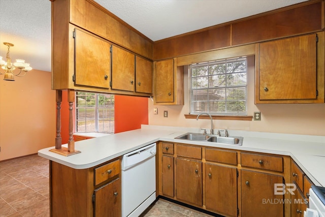 2405 Pavan Dr, Mobile, AL 36693 - kitchen featuring a sink, white dishwasher, a peninsula, and light countertops