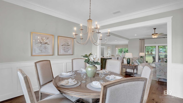 dining area featuring dark wood-type flooring, ceiling fan, and ornamental molding