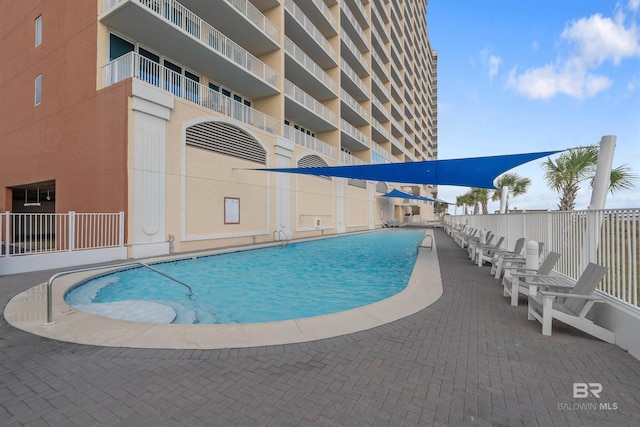 view of swimming pool featuring a patio