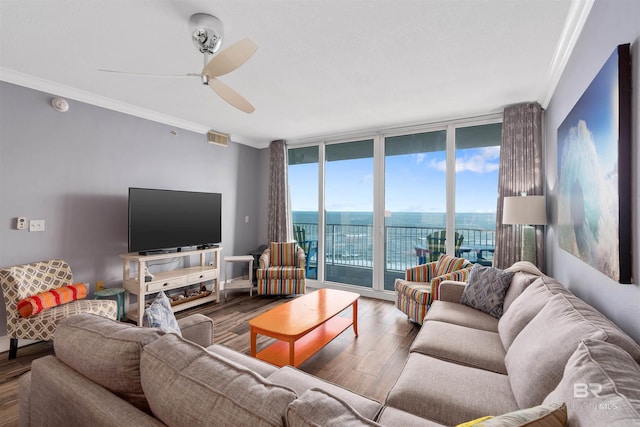 living room with crown molding, hardwood / wood-style floors, floor to ceiling windows, and ceiling fan
