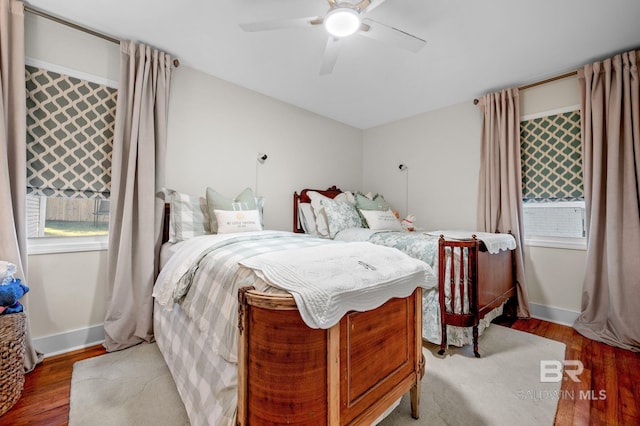 bedroom with hardwood / wood-style flooring and ceiling fan