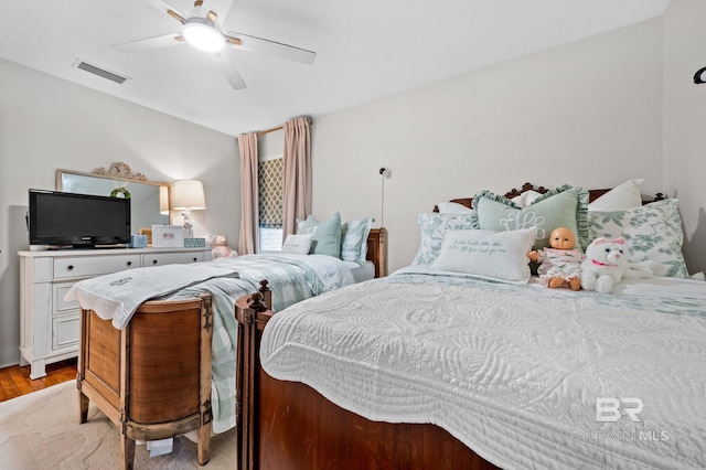 bedroom with ceiling fan and light hardwood / wood-style floors