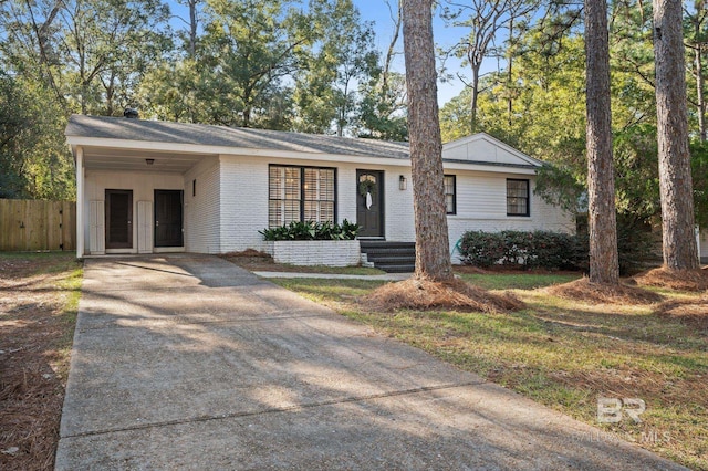 ranch-style home with a carport