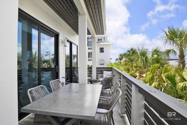 balcony featuring outdoor dining space
