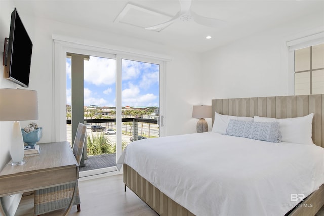 bedroom featuring access to exterior, attic access, ceiling fan, light wood-type flooring, and recessed lighting