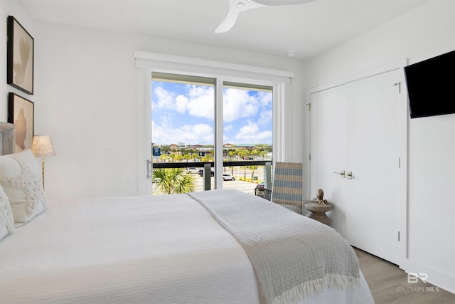 bedroom with a ceiling fan, access to exterior, and light wood-type flooring