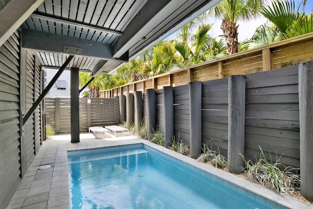 view of pool featuring a fenced in pool and fence