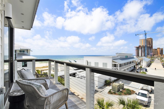 balcony featuring a water view