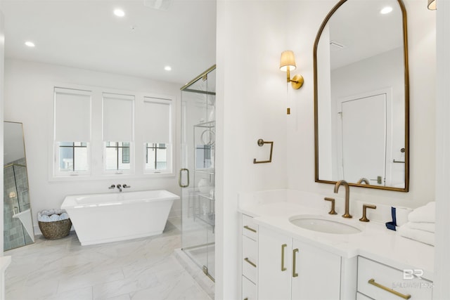 full bathroom featuring vanity, marble finish floor, recessed lighting, a shower stall, and a soaking tub