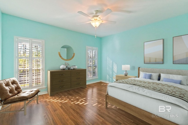 bedroom featuring dark hardwood / wood-style flooring and ceiling fan