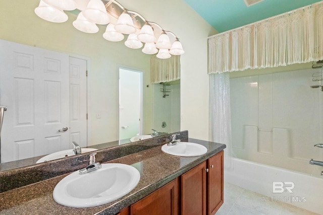 bathroom featuring tile patterned flooring, vanity, and shower / washtub combination