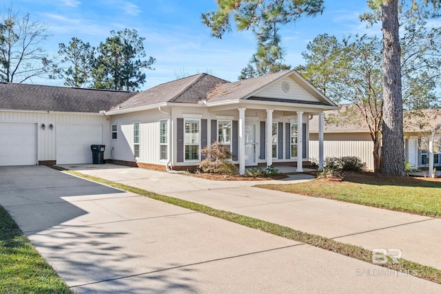 view of front of house featuring covered porch and a garage