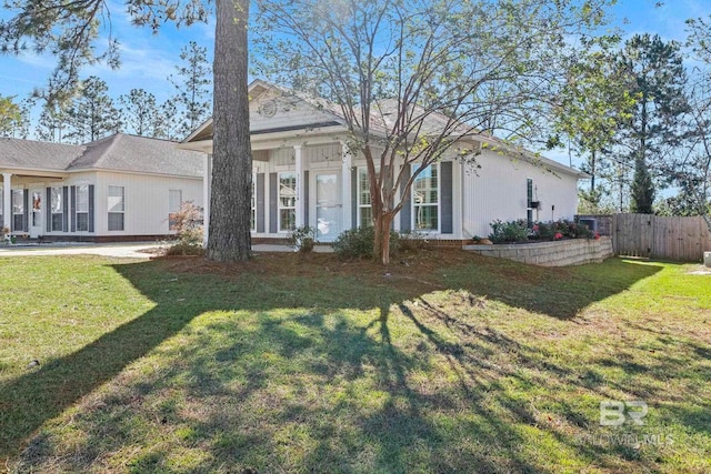 back of house with a yard