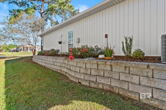 view of side of property with a yard