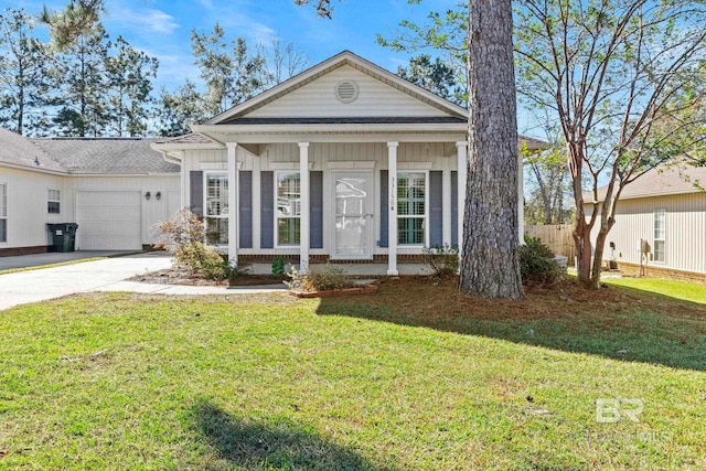 view of front facade featuring a porch, a garage, and a front lawn