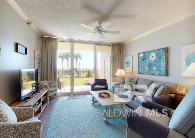 527C Beach Club Trl Unit C-0104, Gulf Shores, AL 36542 - living area featuring a wall of windows, crown molding, a textured ceiling, a ceiling fan, and wood finished floors