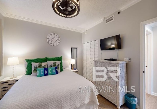 527C Beach Club Trl Unit C-0104, Gulf Shores, AL 36542 - bedroom featuring crown molding