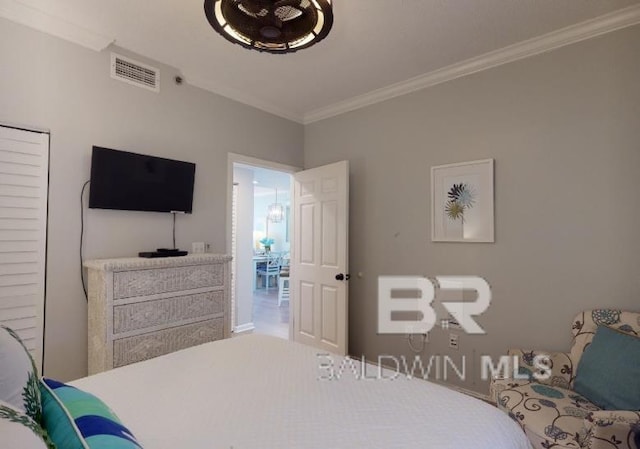 527C Beach Club Trl Unit C-0104, Gulf Shores, AL 36542 - bedroom featuring ornamental molding and baseboards