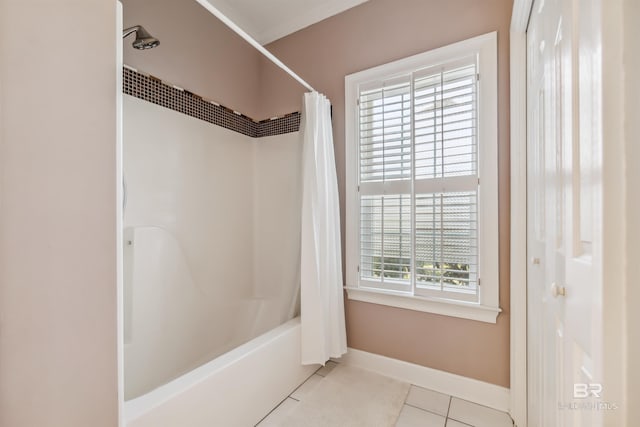 full bath featuring tile patterned flooring, shower / bath combination with curtain, and baseboards