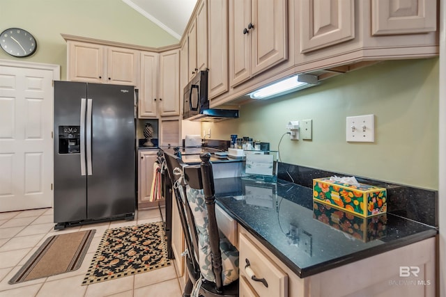 kitchen featuring crown molding, black microwave, stainless steel fridge with ice dispenser, vaulted ceiling, and light tile patterned flooring