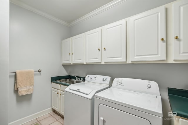 clothes washing area with washer and dryer, a sink, cabinet space, light tile patterned flooring, and crown molding