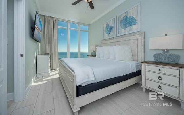 bedroom with crown molding and ceiling fan