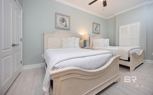 bedroom with crown molding, ceiling fan, and light hardwood / wood-style flooring