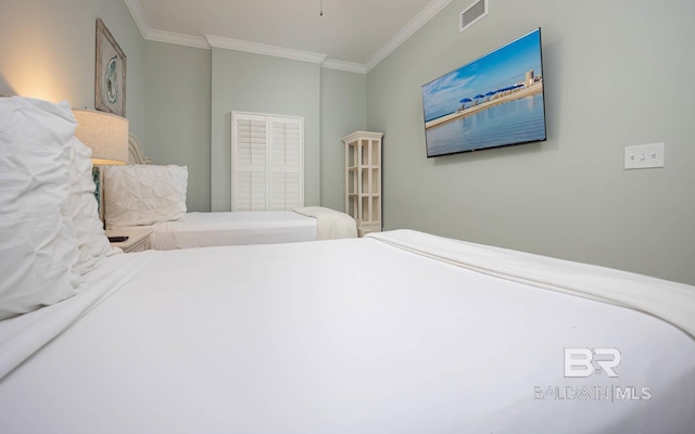 bedroom featuring crown molding