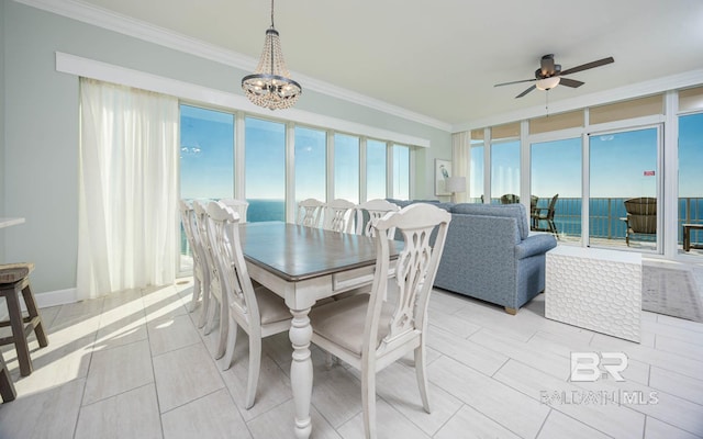 dining area featuring crown molding and ceiling fan with notable chandelier