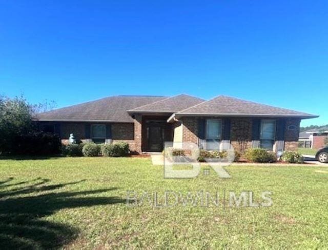 single story home with a front yard