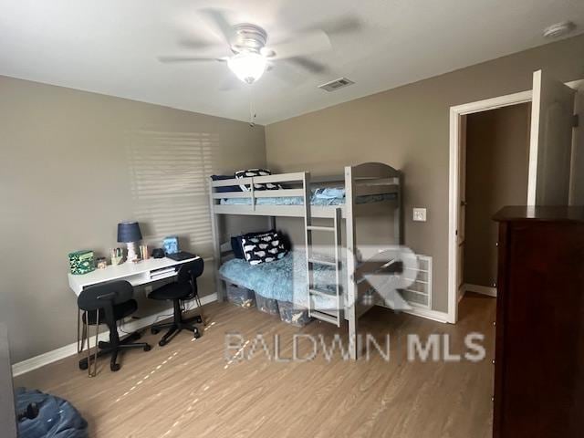 bedroom featuring hardwood / wood-style flooring and ceiling fan