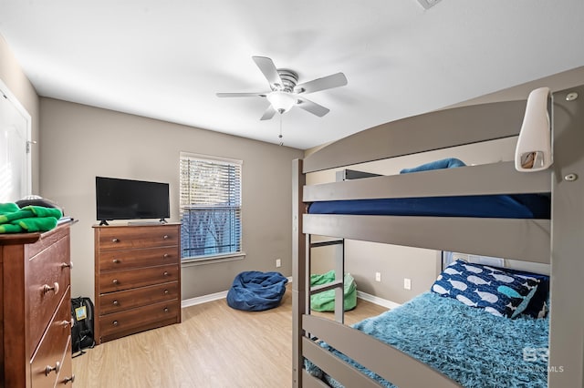 bedroom with hardwood / wood-style flooring and ceiling fan