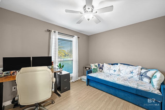 bedroom with ceiling fan and light hardwood / wood-style flooring