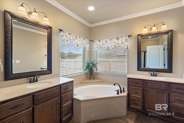bathroom featuring a sink, ornamental molding, a garden tub, and two vanities