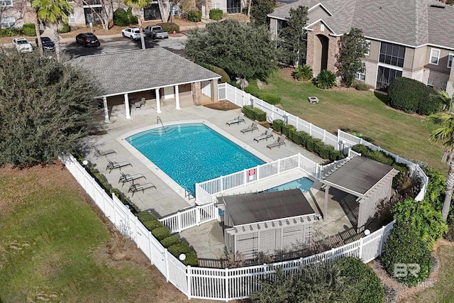 view of pool featuring a lawn, a pergola, and a patio