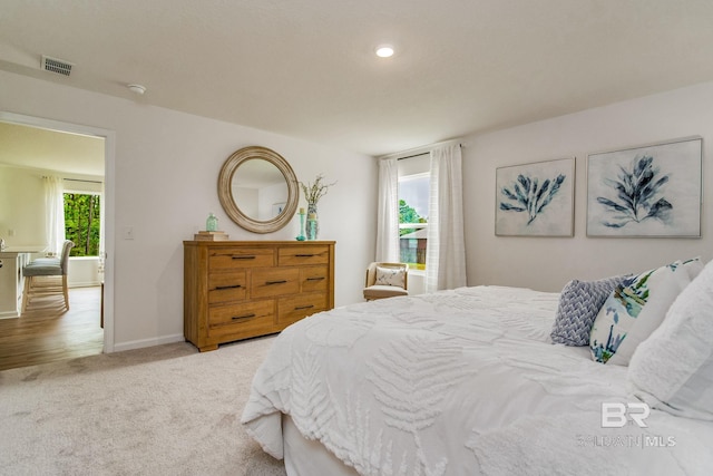 carpeted bedroom featuring visible vents, recessed lighting, and baseboards