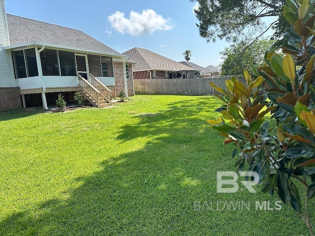 view of yard with a sunroom