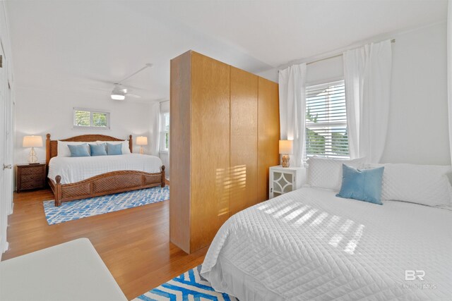 bedroom featuring a closet and light wood-style flooring