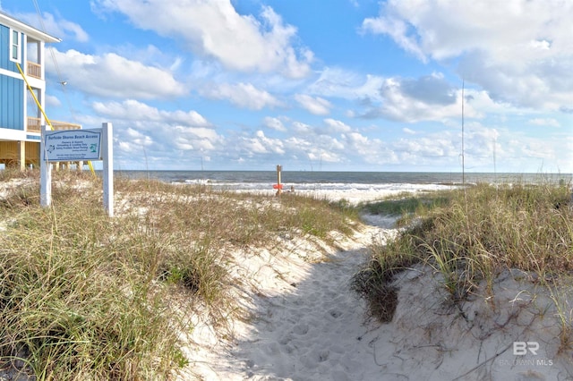 property view of water featuring a beach view