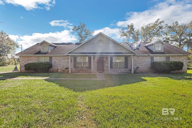 view of front of house featuring a front yard and covered porch