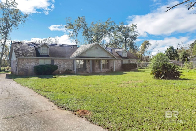 view of front of house with a front lawn and covered porch