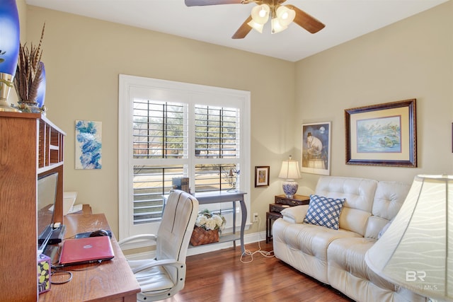 office with ceiling fan and dark hardwood / wood-style flooring